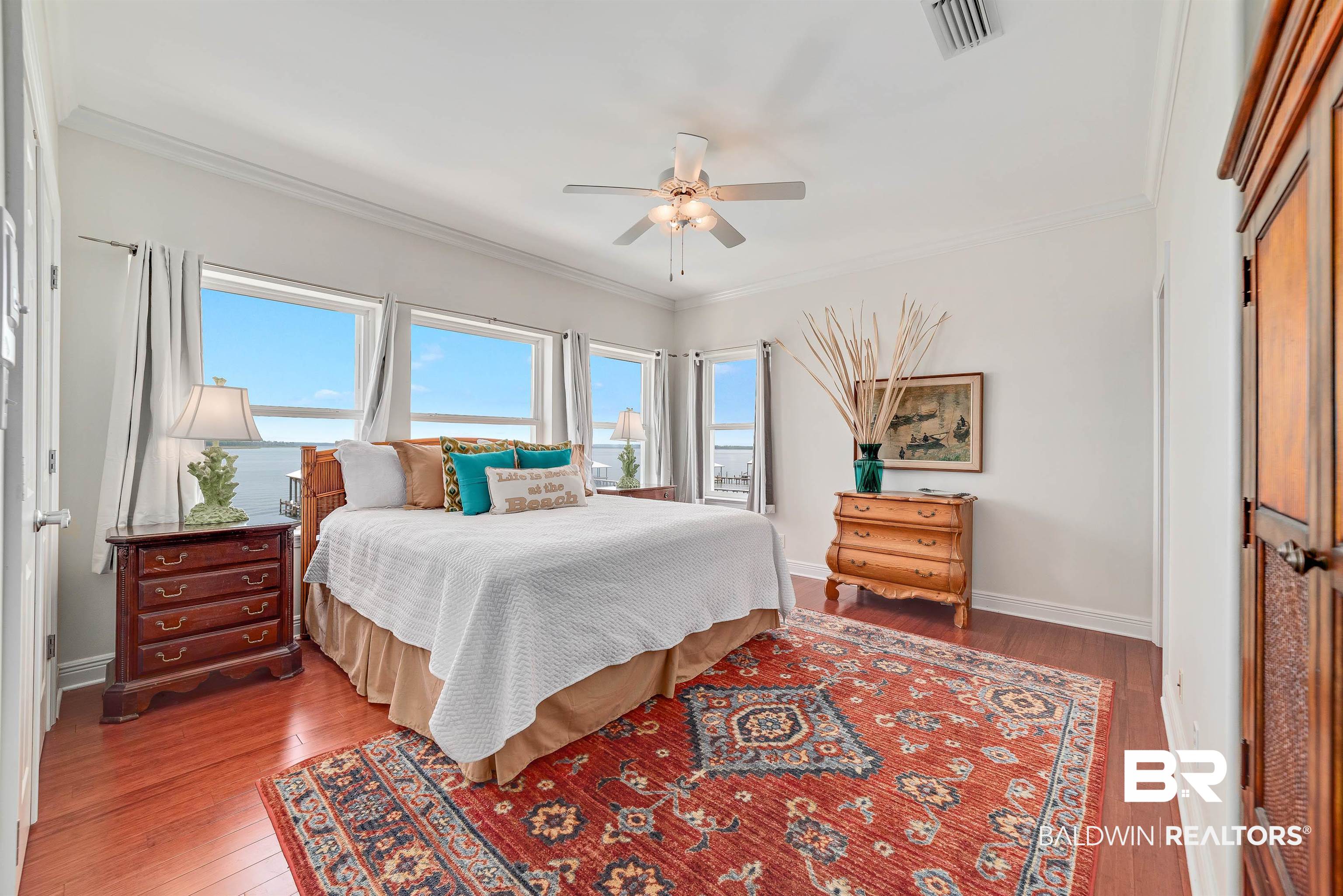 24513 Gulf Bay Road Orange Beach, AL 36561 - Photo 31 of 52 Bedroom with dark hardwood / wood-style flooring, ornamental molding, and ceiling fan