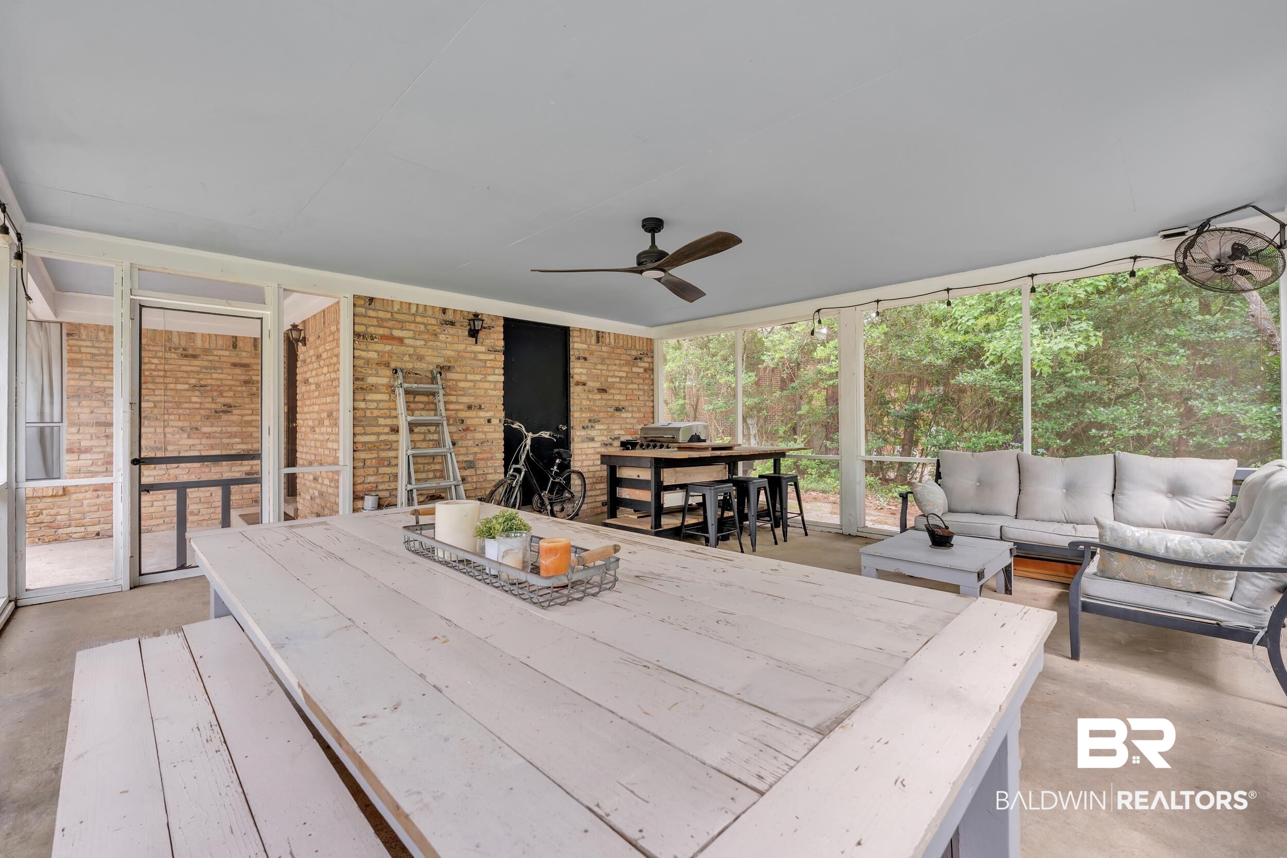 224 Cache Circle Mobile, AL 36611 - Photo 26 of 42 Sunroom featuring outdoor dining area, ceiling fan, and an outdoor living space