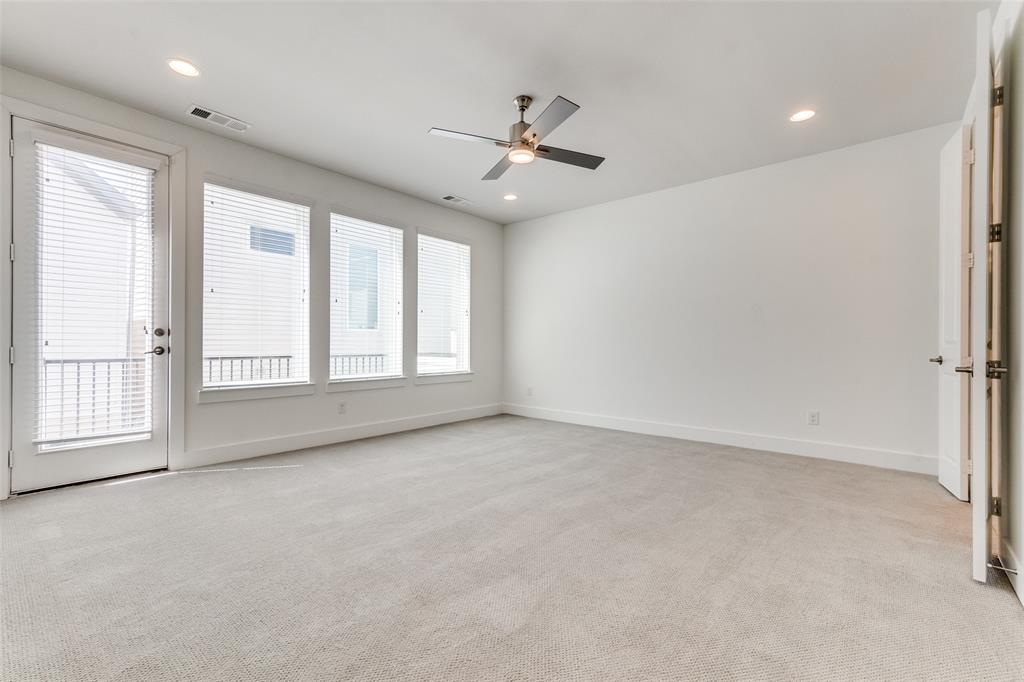 1119 Lavender Ridge Dallas, TX 75204 - Photo 10 of 24 Enjoy the space of this spacious primary escape covering the entire third floor of the home complete with double vanity, large walk in closet, and private balcony.