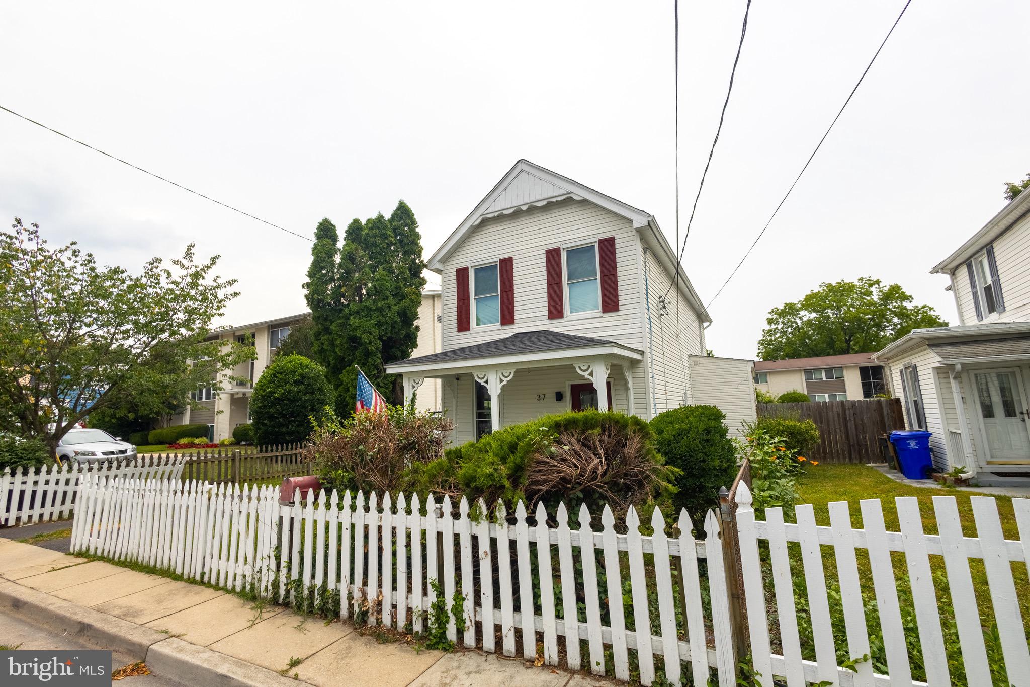 37 4th Street Laurel, MD 20707 - Photo 24 of 26 a front view of white house with a small yard