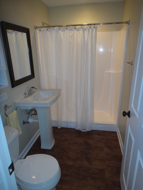 5711 Willow Springs Road Countryside, IL 60525 - Photo 11 of 17 a bathroom with a sink toilet and shower