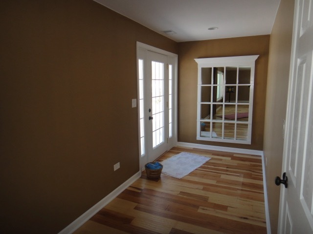 5711 Willow Springs Road Countryside, IL 60525 - Photo 2 of 17 a view of a room with wooden floor and a window