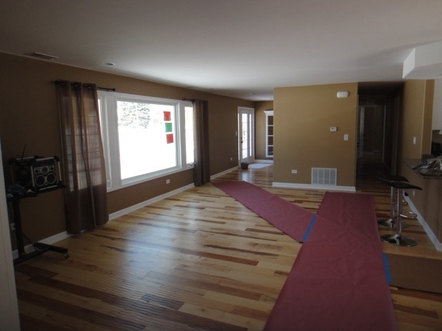 5711 Willow Springs Road Countryside, IL 60525 - Photo 3 of 17 a spacious bedroom with a bed and a flat screen tv