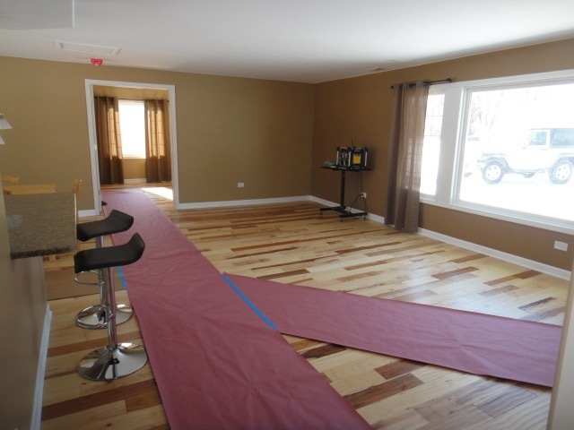 5711 Willow Springs Road Countryside, IL 60525 - Photo 4 of 17 a bedroom with a bed and wooden floor