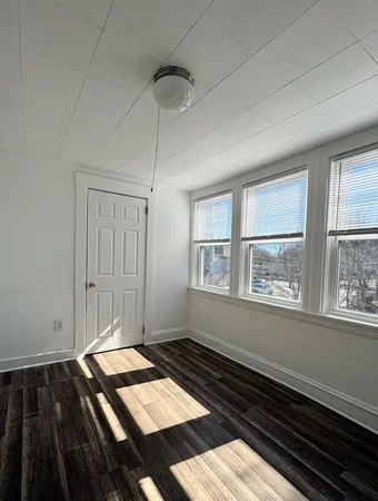 a bedroom with bed and a window