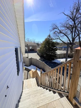 a view of balcony with furniture
