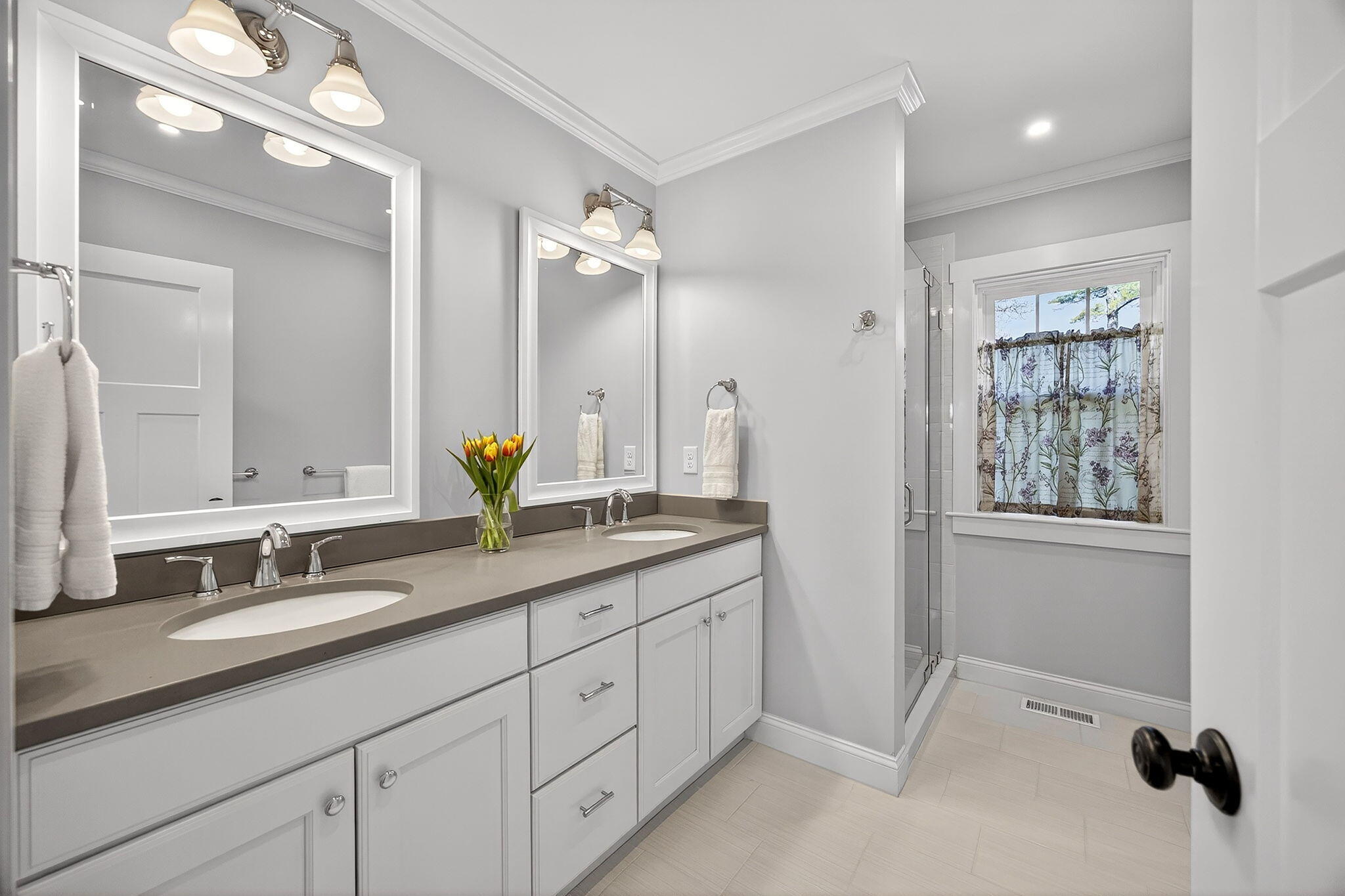 176 Bumps River Road Osterville, MA 02655 - Photo 21 of 54 a bathroom with a double vanity sink and a mirror