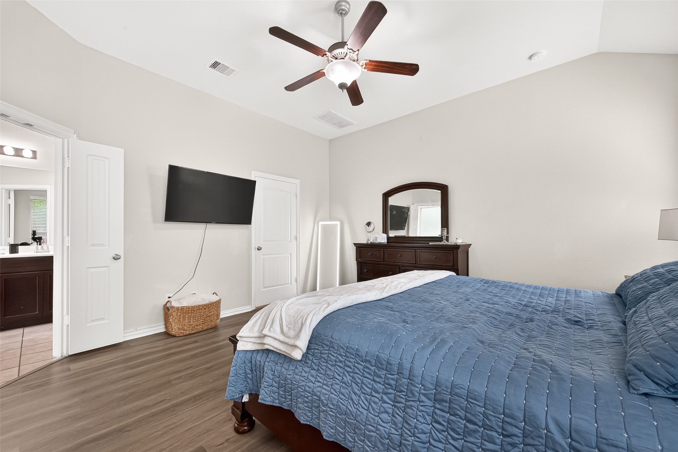 8 Landscape Court Conroe, TX 77301 - Photo 24 of 43 a bedroom with a bed window and a flat screen tv