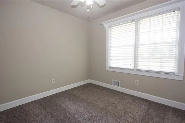 a backyard of a house with yard and garage