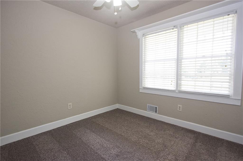 4541 Center Hill Church Road Loganville, GA 30052 - Photo 19 of 25 an empty room with a window