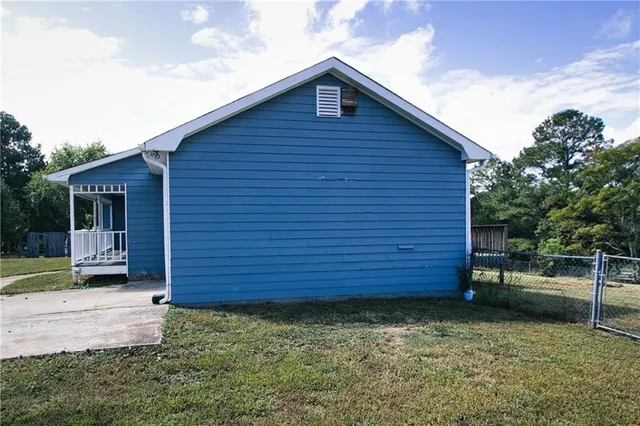 a balcony with wooden floor and fence