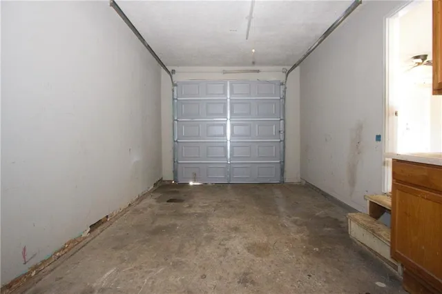 an empty room with a empty space and windows