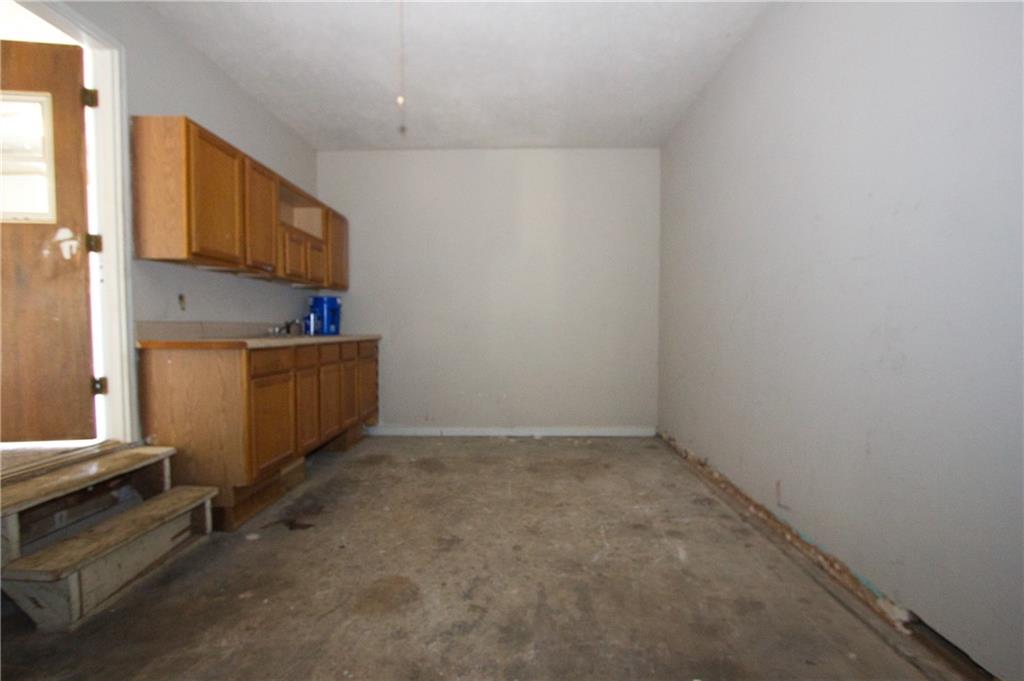 4541 Center Hill Church Road Loganville, GA 30052 - Photo 8 of 25 an empty room with windows