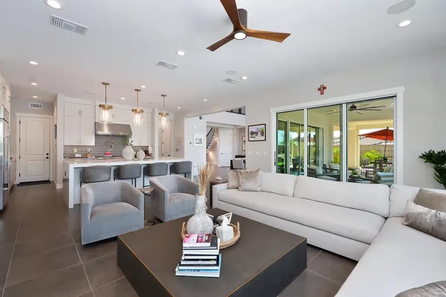 a view of a kitchen with sink and window