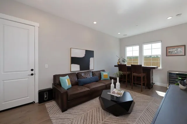 a view of a house with swimming pool and sitting area