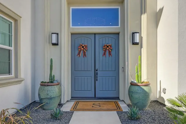a dining room with furniture a large window and a table