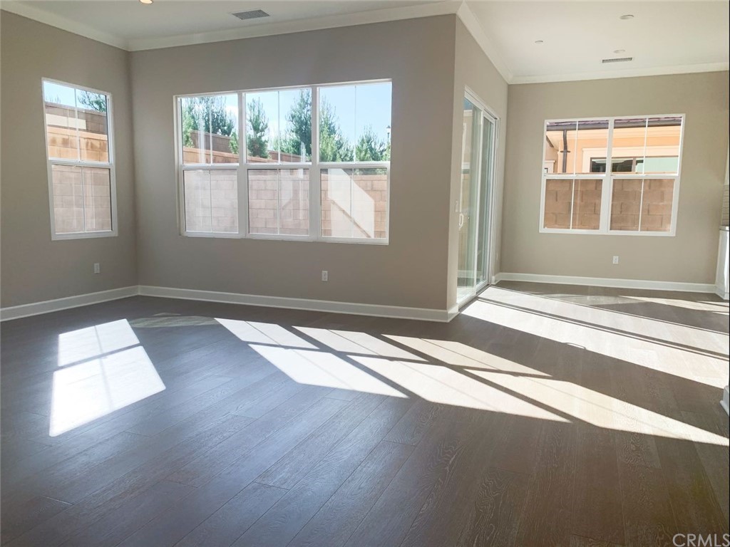 68 Singer Irvine, CA 92620 - Photo 2 of 12 a view of empty room with wooden floor and fan