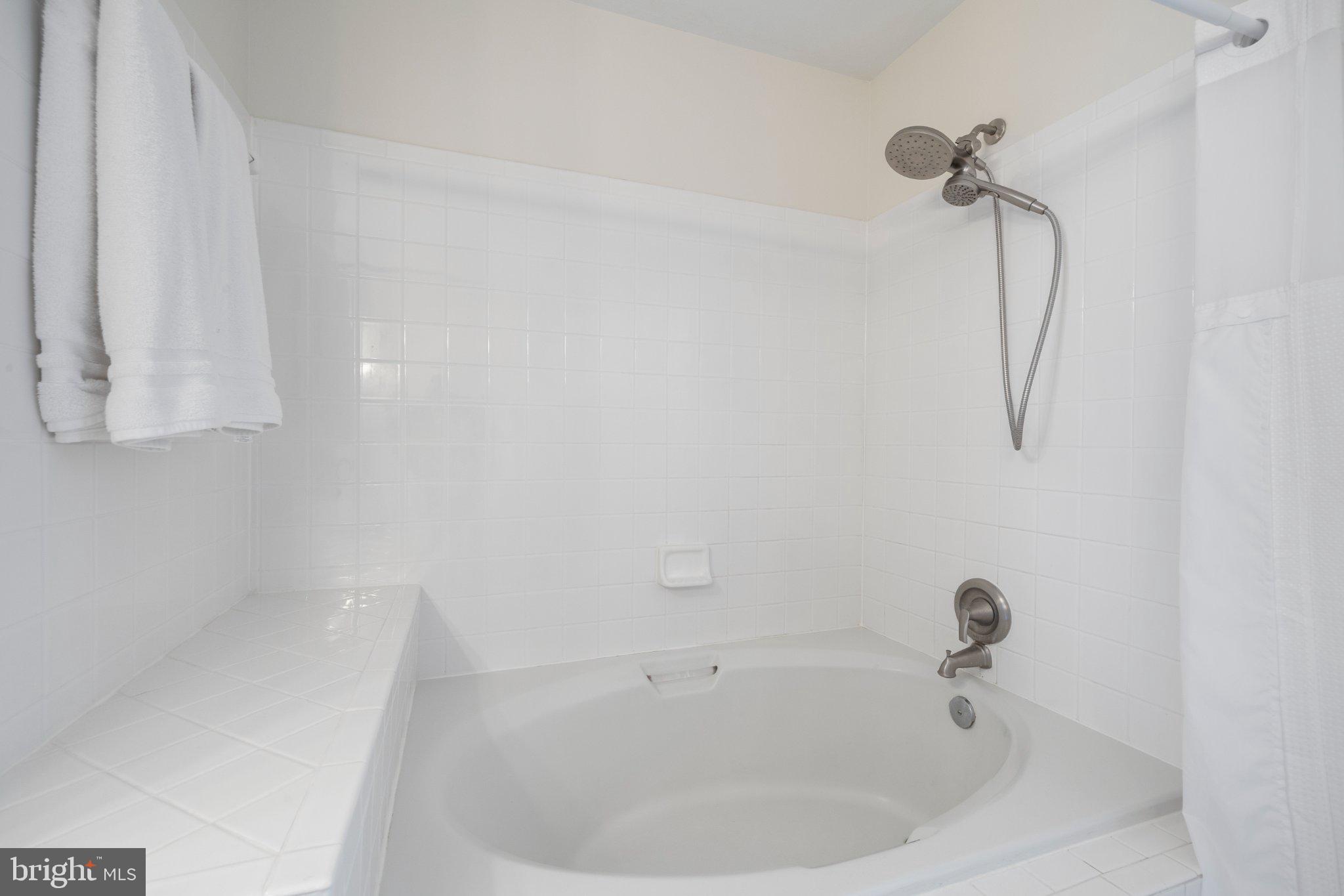 408 Ridgepoint Place, Unit 40838 Gaithersburg, MD 20878 - Photo 20 of 38 Serene white bathroom retreat.