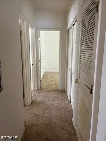 a view of a hallway with closet area