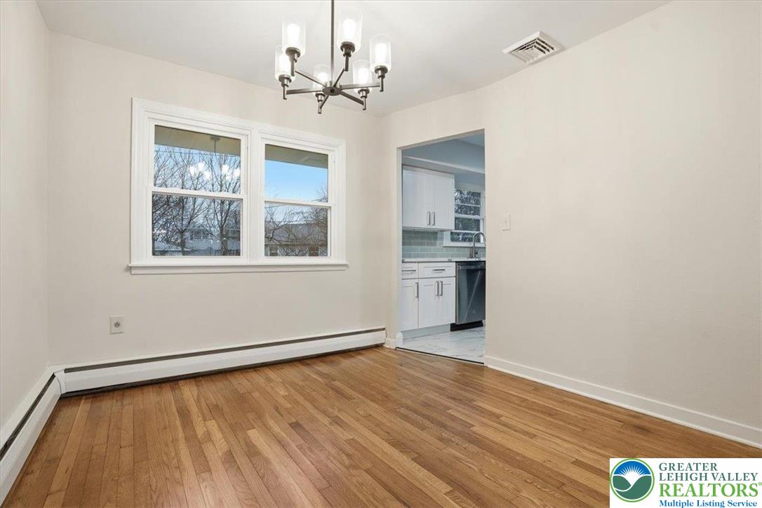 3120 Hilly Road Bethlehem, PA 18017 - Photo 11 of 37 a view of an empty room with a window and wooden floor
