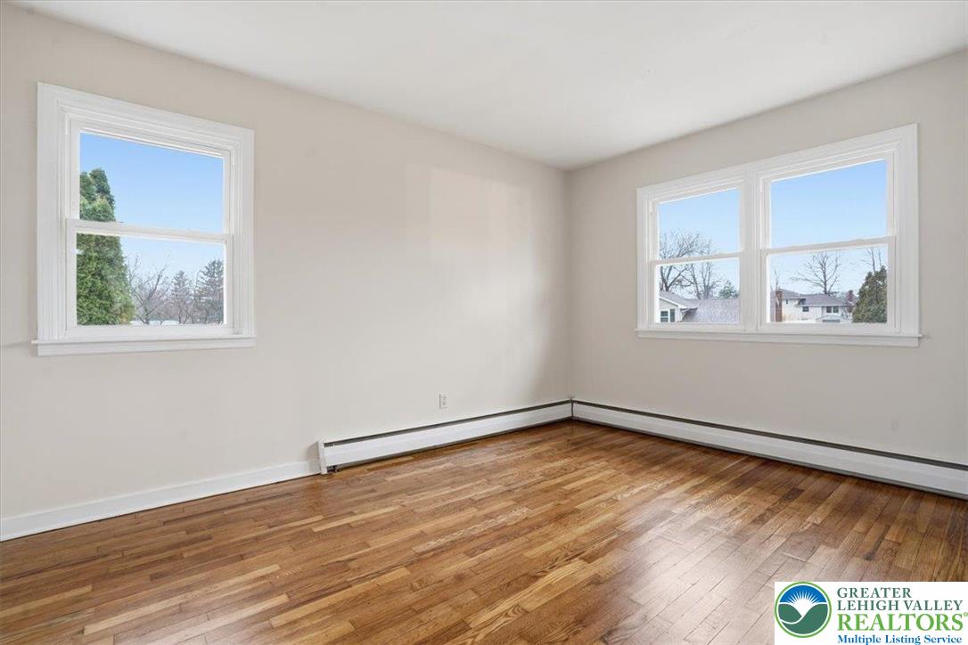 3120 Hilly Road Bethlehem, PA 18017 - Photo 18 of 37 a view of an empty room with wooden floor and a window