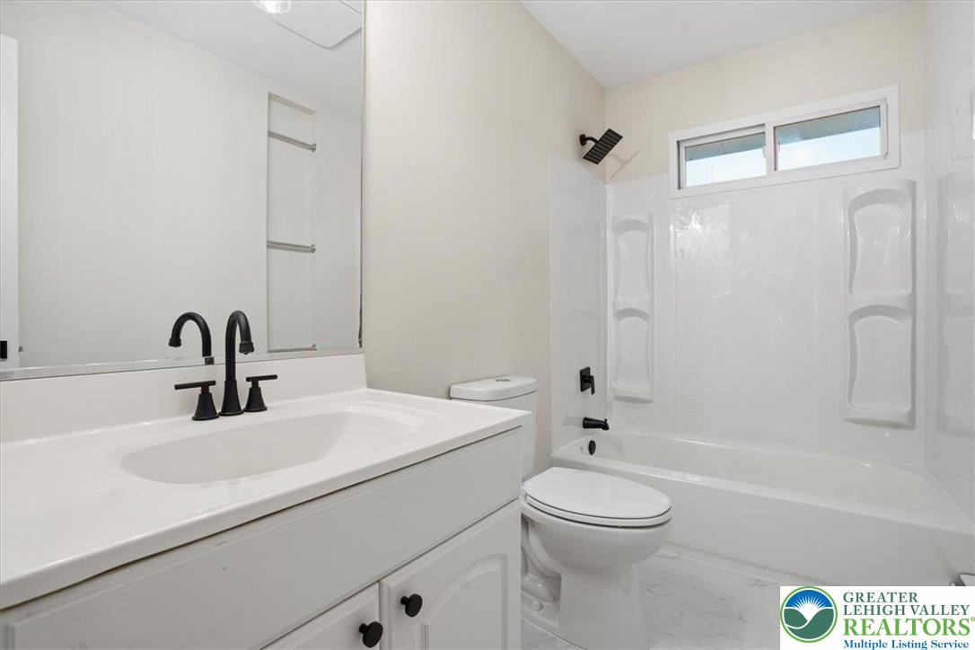 3120 Hilly Road Bethlehem, PA 18017 - Photo 20 of 37 a bathroom with a sink a toilet and a mirror