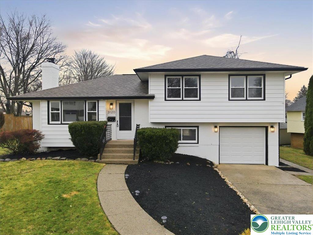 3120 Hilly Road Bethlehem, PA 18017 - Photo 2 of 37 a front view of a house with a yard and garage