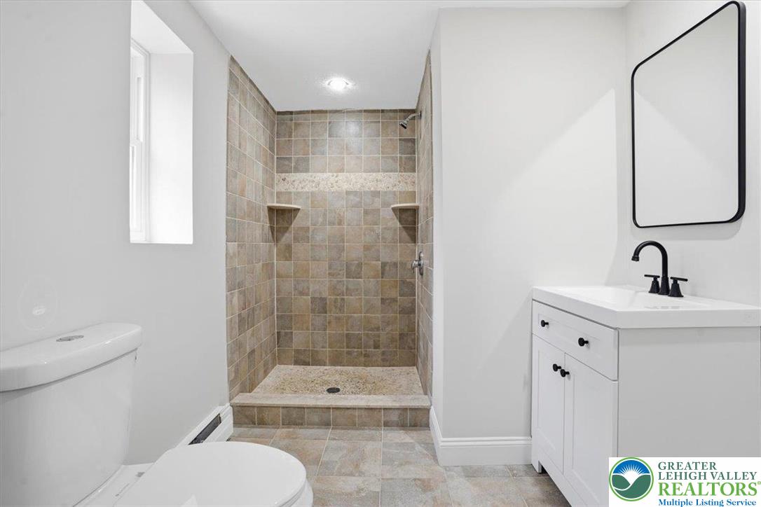 3120 Hilly Road Bethlehem, PA 18017 - Photo 24 of 37 a bathroom with a sink a toilet and shower