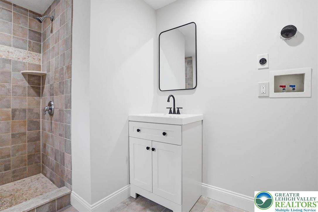 3120 Hilly Road Bethlehem, PA 18017 - Photo 25 of 37 a bathroom with a sink mirror and vanity