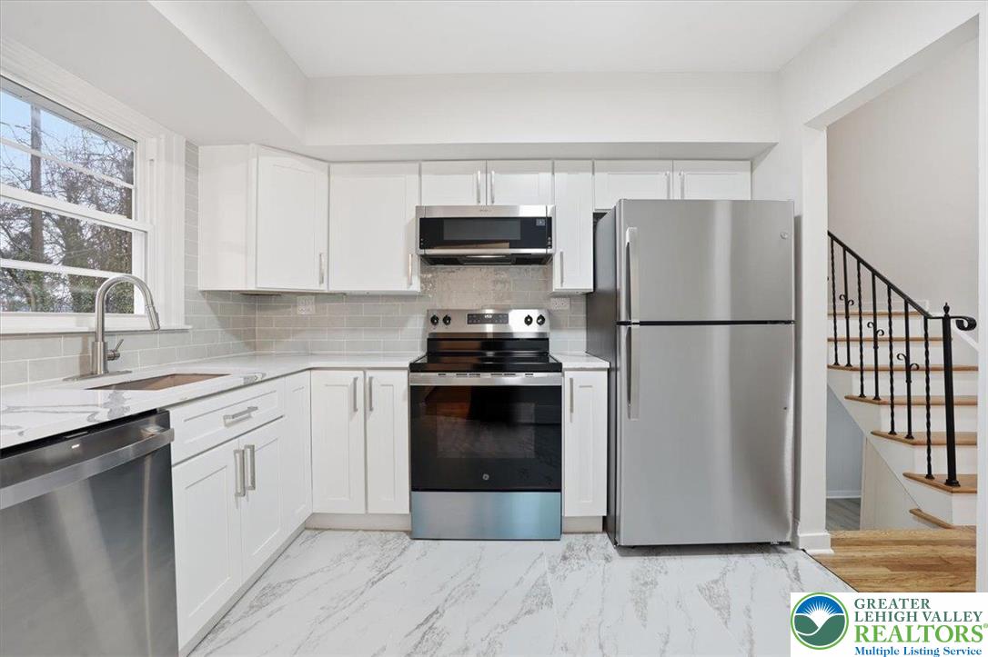 3120 Hilly Road Bethlehem, PA 18017 - Photo 7 of 37 a kitchen with a refrigerator stove and sink