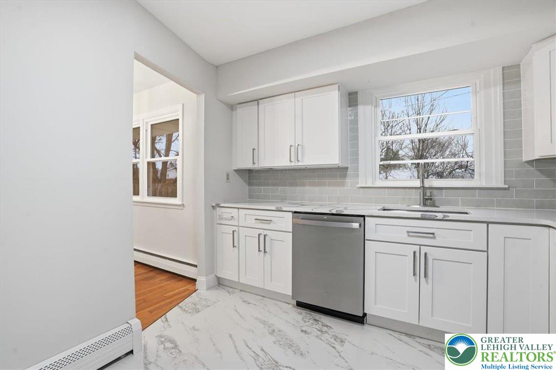 3120 Hilly Road Bethlehem, PA 18017 - Photo 9 of 37 a kitchen with granite countertop white cabinets and white appliances