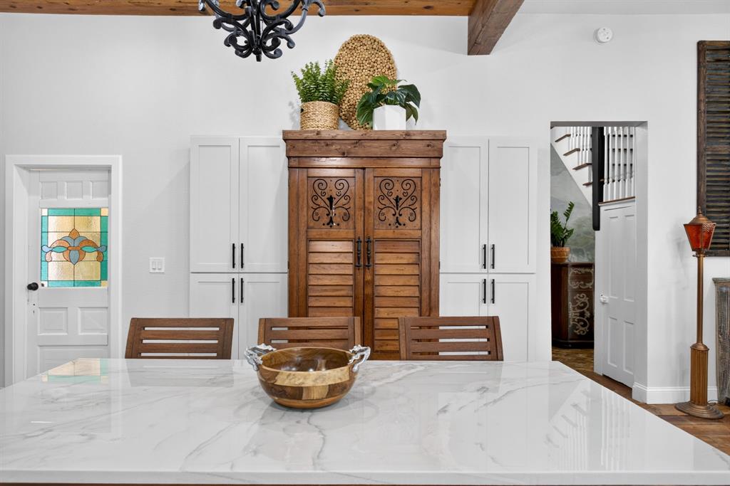702 West Spring Street Weatherford, TX 76086 - Photo 23 of 39 Spacious kitchen island featuring a white countertop with gray veining
