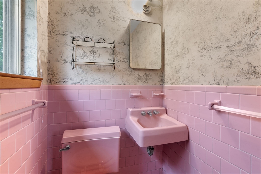 32 Lyman Road Framingham, MA 01701 - Photo 11 of 20 a bathroom with a sink a toilet and mirror