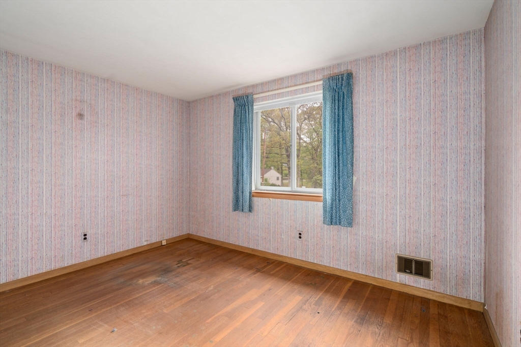 32 Lyman Road Framingham, MA 01701 - Photo 12 of 20 an empty room with wooden floor and windows