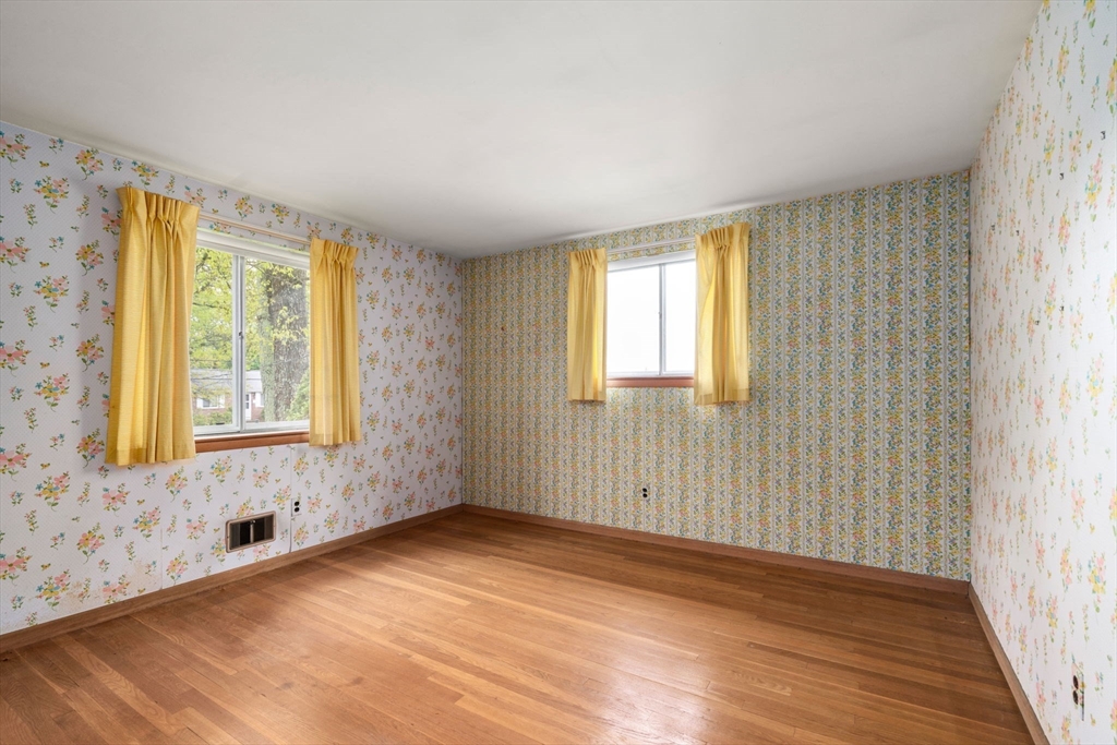 32 Lyman Road Framingham, MA 01701 - Photo 13 of 20 a view of an empty room with wooden floor and a window