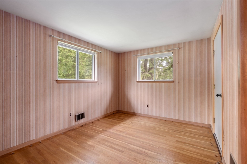 32 Lyman Road Framingham, MA 01701 - Photo 15 of 20 a view of an empty room with wooden floor and a window