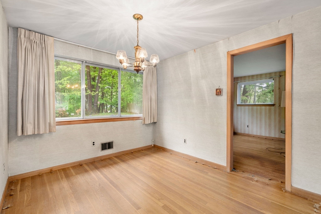 32 Lyman Road Framingham, MA 01701 - Photo 5 of 20 a view of empty room with wooden floor and fan