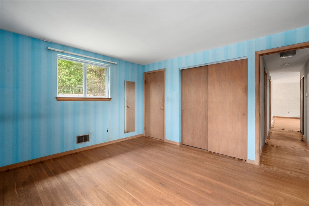 32 Lyman Road Framingham, MA 01701 - Photo 9 of 20 a view of empty room with wooden floor and fan