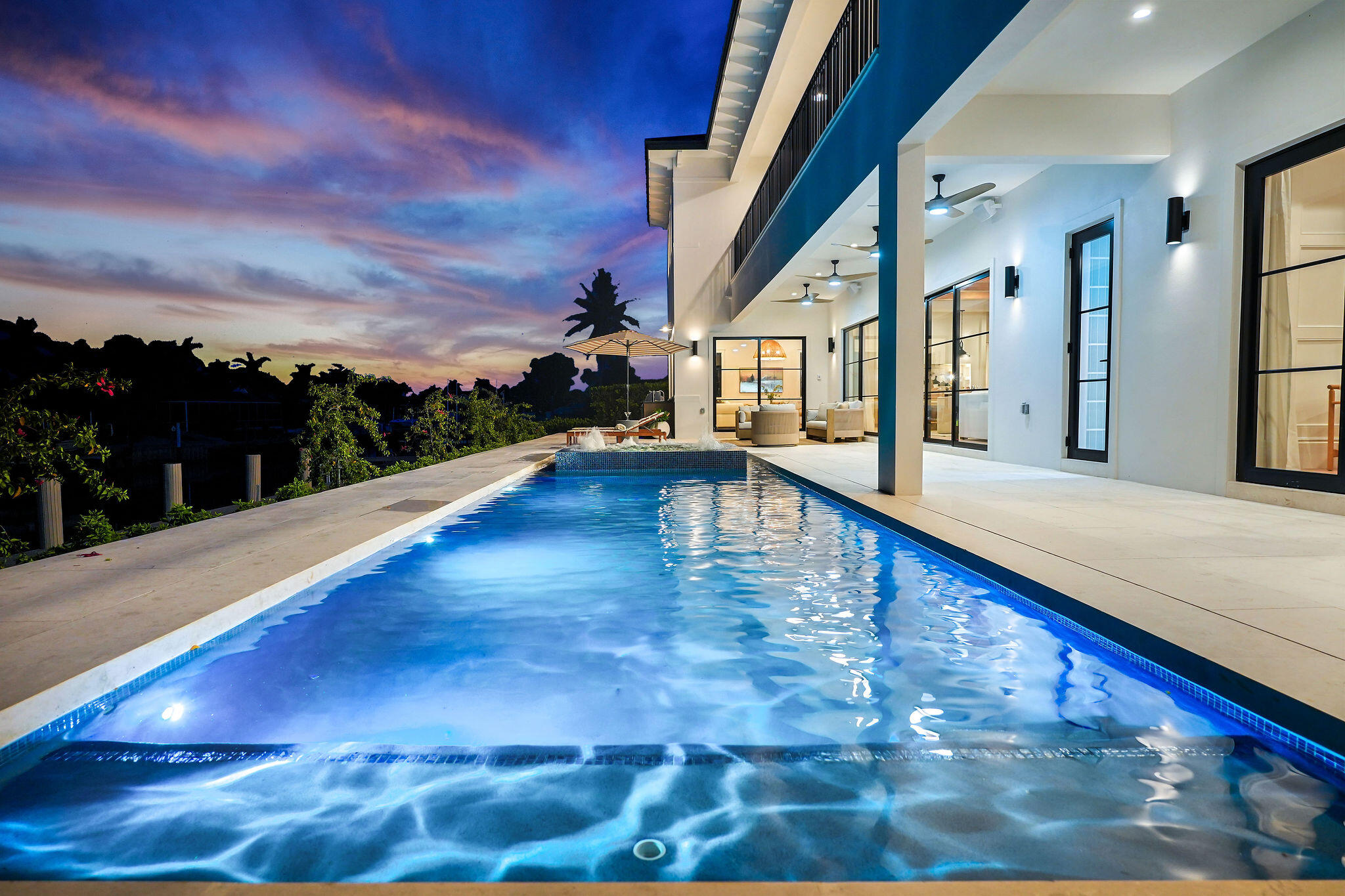 839 Chestnut Court Marco Island, FL 34145 - Photo 67 of 88 Night pool view toward summer kitchen