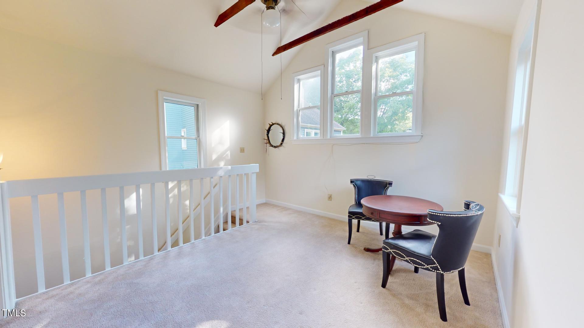 1833 Falls Church Road Raleigh, NC 27609 - Photo 30 of 84 a view of a room with furniture wooden floor and a window