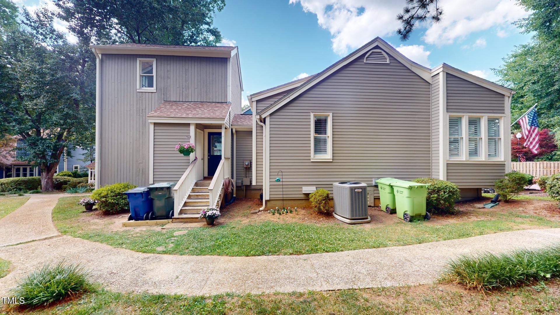 1833 Falls Church Road Raleigh, NC 27609 - Photo 54 of 84 a view of a house with backyard and a tree