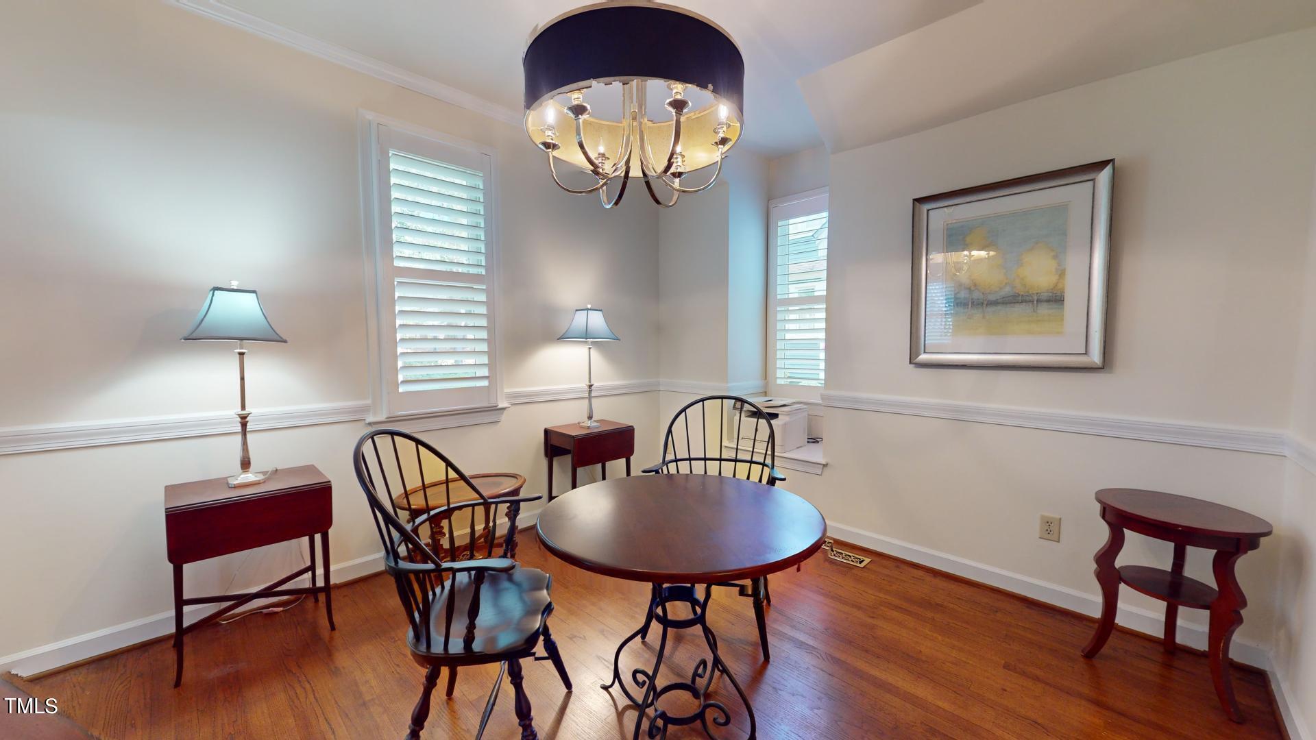 1833 Falls Church Road Raleigh, NC 27609 - Photo 77 of 84 a view of a livingroom with furniture and a lamp
