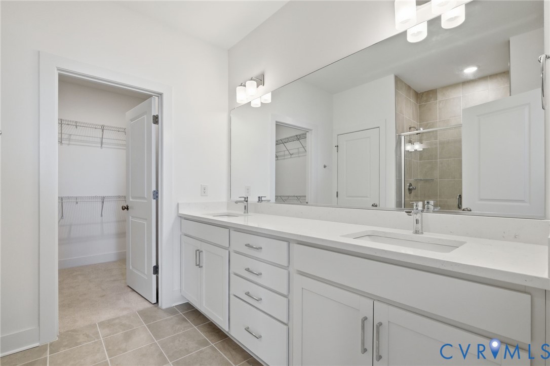 319 Hts Rdg Alley Midlothian, VA 23113 - Photo 16 of 24 a bathroom with a double vanity sink mirror and a shower
