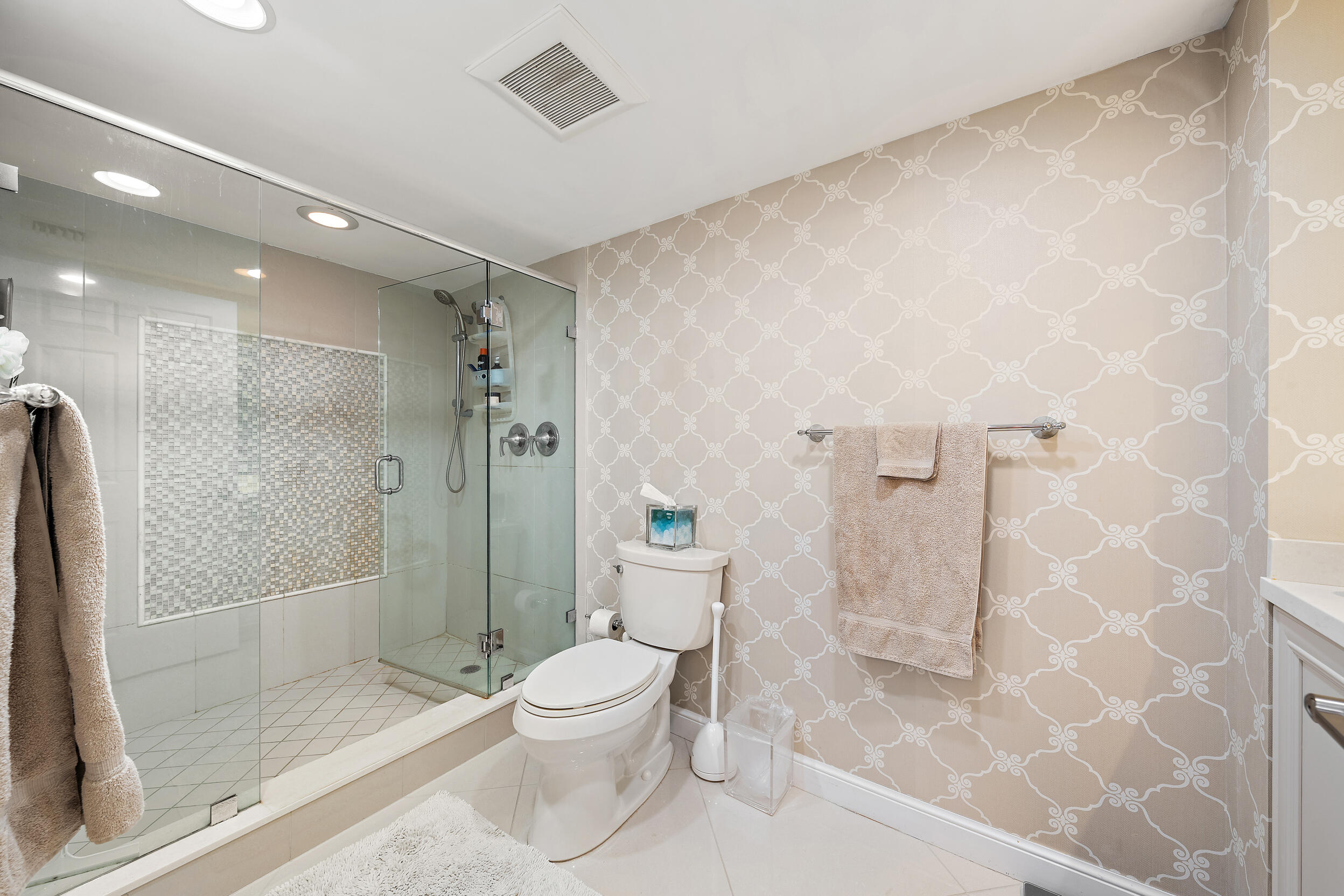 176 Helios Drive, Unit 603 Jupiter, FL 33477 - Photo 13 of 28 a bathroom with a shower and a toilet
