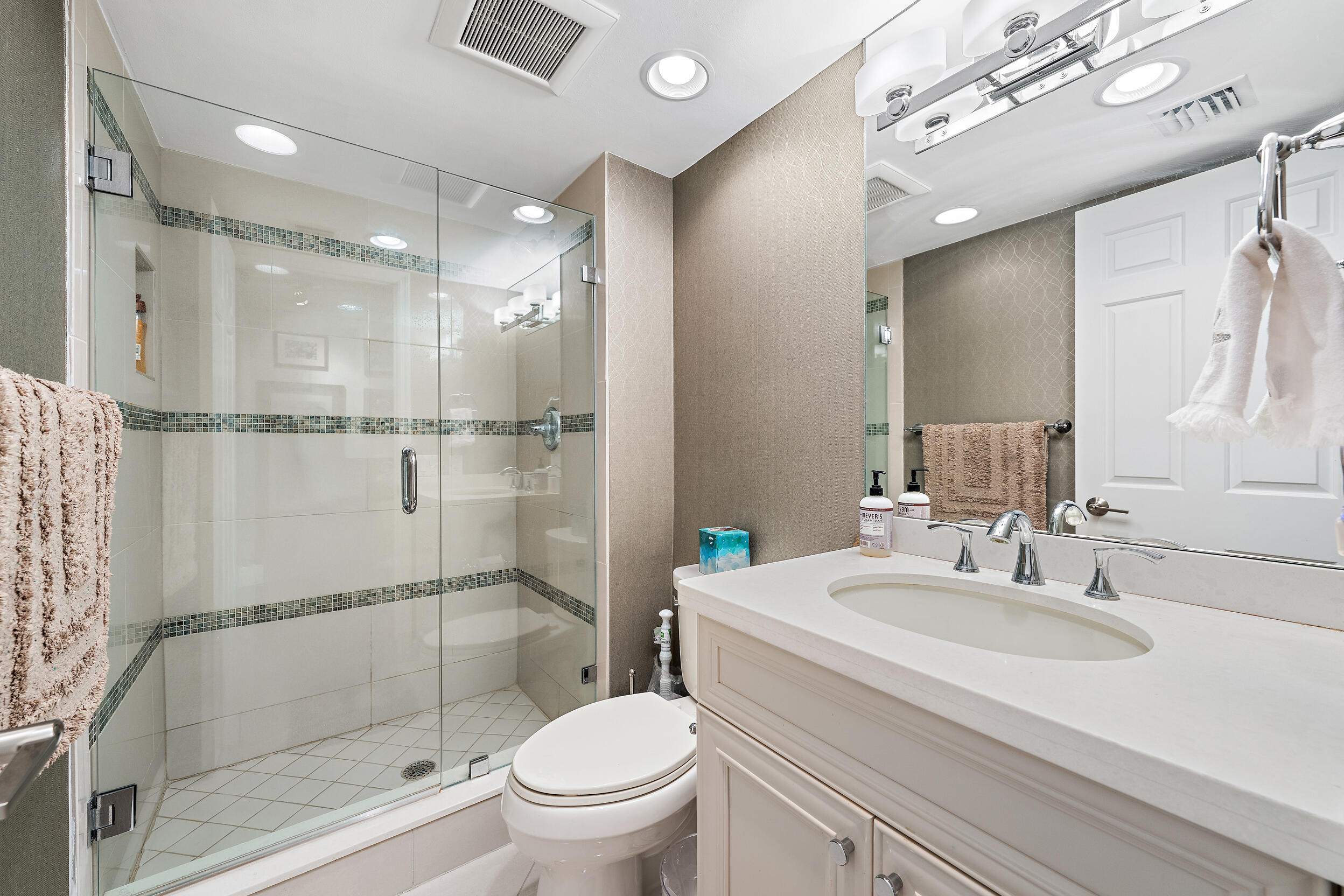 176 Helios Drive, Unit 603 Jupiter, FL 33477 - Photo 16 of 28 a bathroom with a sink toilet and shower