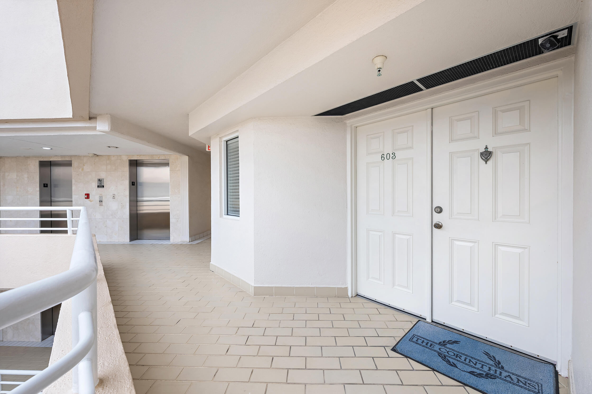 176 Helios Drive, Unit 603 Jupiter, FL 33477 - Photo 19 of 28 a view of a hallway with wooden floor and cabinet