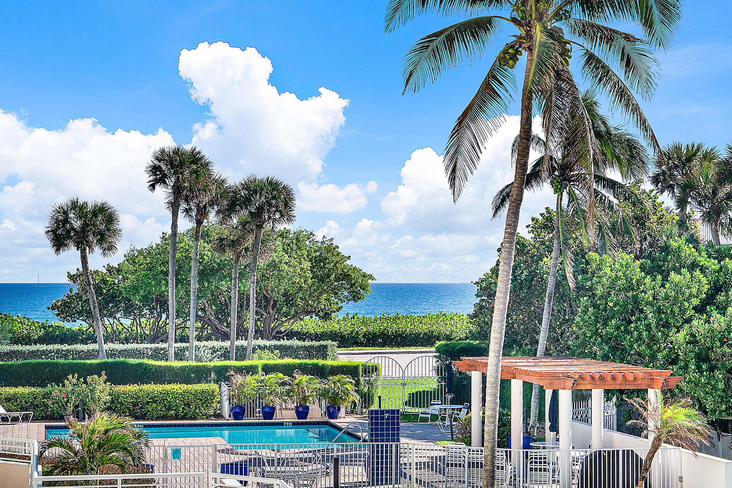 176 Helios Drive, Unit 603 Jupiter, FL 33477 - Photo 20 of 28 a view of a house with a yard and potted plants