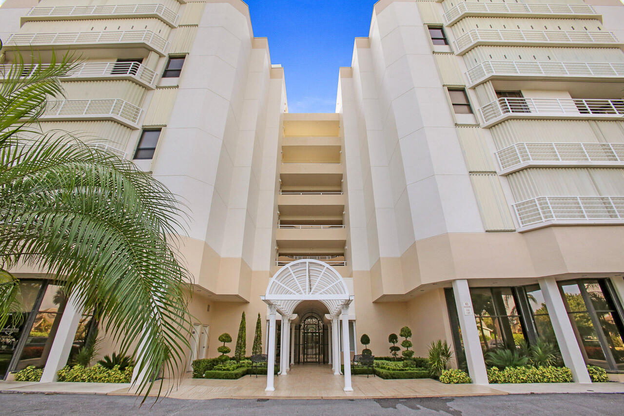 176 Helios Drive, Unit 603 Jupiter, FL 33477 - Photo 25 of 28 a front view of a multi story residential apartment building with entryway