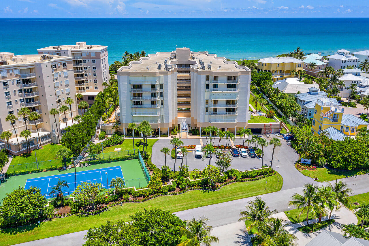176 Helios Drive, Unit 603 Jupiter, FL 33477 - Photo 26 of 28 a view of a building and yard with green space