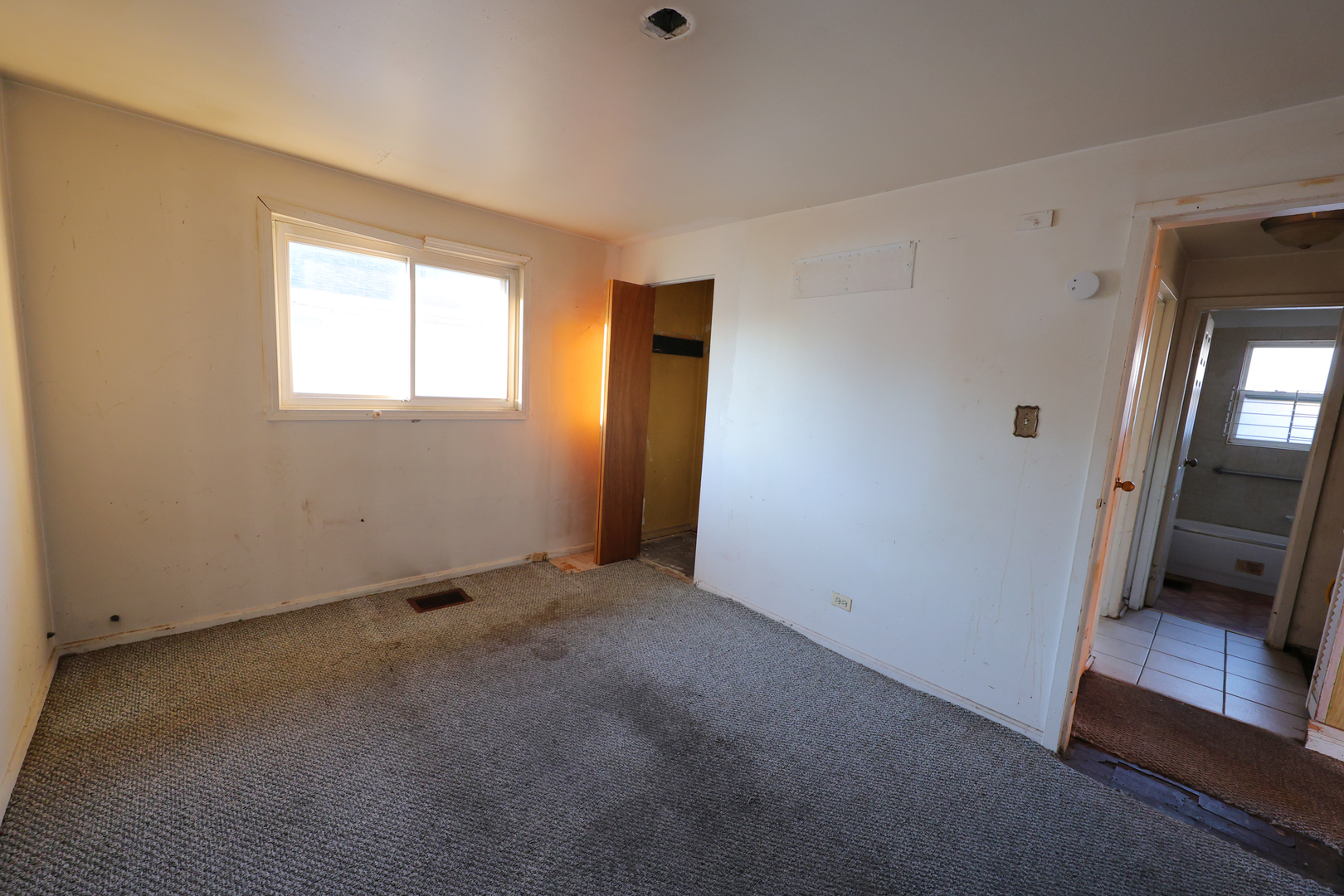 3210 Mc Breen Avenue Robbins, IL 60472 - Photo 13 of 21 a view of an empty room with a fireplace and a window